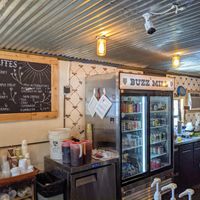 Hot and cold drinks and a restroom, surrounded by food trucks. at The Buzz Mill in Austin