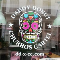 Logo on the window at Daddy Donut x Churros Cartel in The Hague