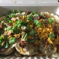 Biscuit and gravy with vegan bacon  at Biscuits + Groovy - Food Trailer Barton Springs in Austin