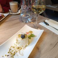 Pistachio Panna Cotta with white chocolate sauce and home white wine #Veganuary at Manna 68 in Gdansk