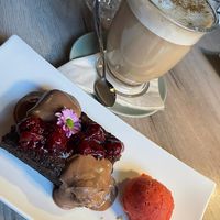 Brownie with chocolate sauce, ice cream and chai latte #Veganuary at Manna 68 in Gdansk