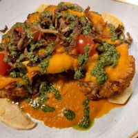 Cauliflower steak with oyster mushrooms and tomato sauce, apples and pesto at Manna 68 in Gdansk