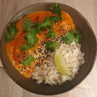 Indian vegetable koftas with tofu and plums in a velvety fenugreek sauce, served with GF pulao rice at Manna 68 in Gdansk