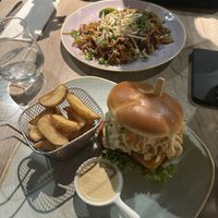 fish burger with potato wedges and stir-fry  at Manna 68 in Gdansk