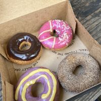 Tasting box: Chocolate to replace the Miso Honey; Rick Martinez (pink one); Chaga Chai, and Purple Haze...  at Holey Grail Donuts - Food Truck in Hanalei