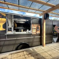 Covered area in front of the truck is a great place to gobble those donuts immediately    at Holey Grail Donuts - Food Truck in Hanalei