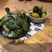 Padron peppers and olives  at Punch Bar and Tapas in Honley