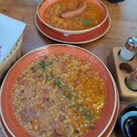 Ričet (plate in front) - stew made with barley, beans and vegetables at Gostilnica Štrud'l in Bohinjska Bistrica