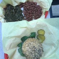 Beyond burger on gluten free bun with side of collard greens & spicy red beans at Amber's Smoked Vegan in Las Vegas