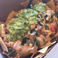 Nachos with chicken and chipotle salsa. Enough para tres personas! at Vegan GreenGO in Santa Barbara