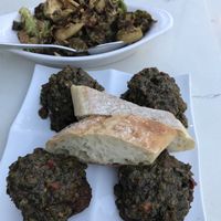 Quinoa balls with spicy cilantro sauce. Side of Brussels sprouts at Mimi Blue Meatballs in Indianapolis