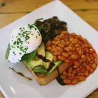 avocado, poached egg, beans and mushrooms on chunky toast  at The Snug in Atherton