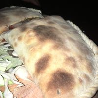 Vegan calzone with vegan cheese and vegetables  at Syncopa Bar in Haifa