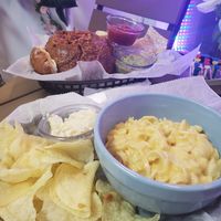 Mac and cheese, chips, and potato salad (front); chilli in a bread bowl with chips, salsa, and guac (back) at Bread Bowl Cafe in Milford