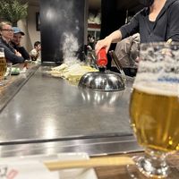 Okonomiyakis being prepared  at Kamehameha - かめはめは in Kyoto