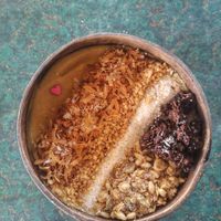 Tropical Smoothiebowl with granola, roasted coconutflakes and peanuts   at Indiana vegan Cafe & Yoga in Langkawi