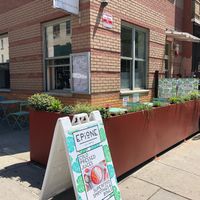 Sun and shade outdoor seating  at Ambrosia Elixirs in Brooklyn