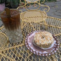 Coconut donut and oat milk iced latte at Narcisa Vegan Bakery in San Salvador