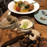Dessert sampler, and jambalaya in the background at Bananeira in Yokohama