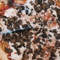 large pizza w follow your heart vegan cheese and mushrooms  at Mellow Mushroom - International Dr in Orlando