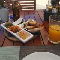 Appetizers: Olives, humus, green beans and carrots, and marinated tofu at Terra Restaurant in Sagres