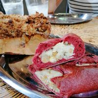 Rice bread (back) and vegan cheese filled bread with fruits nuts and chickpeas at Milhanjum 밀한줌 - Jungang Station in Busan