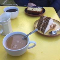 Coffee with walnut cream cake and jam n coconut sponge 😍 at Karmic Cakery in Berwick-upon-tweed