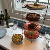 Chips, fava dip, planted meat, gigandes, filo triangles  at The Real Greek - Covent Garden in London