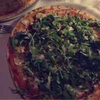 Pizza with mushrooms, rocket, tahini, falafel and vegan mozzarella cheese  at Be Bop in Milan