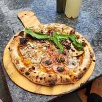1/2 and half pizza: 1/2 margherita with mushrooms and half da house with tofu and arugula. excellent dough at Salgados Veganos Manaus in Manaus