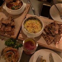 (Top to bottom) baked herbed feta, spinach artichoke dip, phyllo roll  at Katharos Lounge in Santorini