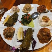 Chef Rachid Platter: hummus, babaganoush, tabouli, grape leaves, eggplant salad, moussaka, mujadara, mujamarra at Kareem's in Naples