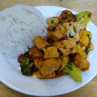 Fried tofu with vegetable, mushrooms, tomato sauce and rice. at V-Cuisine in Hanoi