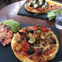 Pizza with cheese at Bookish in Crickhowell