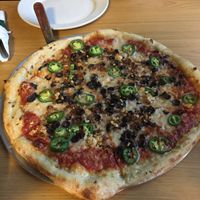 Large build-your-own pizza with jalapeños, black olives, garlic, soy chorizo, and UnMoo vegan cheese. at The Hop in Richmond
