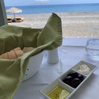 Bread with olive oil and a white dip we’re not sure if it was vegan or not. at Vassilikos in Santorini