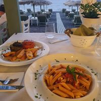 Greek Penne with Tomatoes, Basil and Feta. If you order them without Feta the fish becomes vegan.  at Vassilikos in Santorini