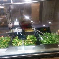 Deli case. Daily kale, lemon, garlic, plain at Sunshine's Health Food Store and Vegetarian Deli in Houston