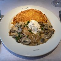 Züri Geschnetzeltes:
Champignon, Bio-Seitan, Weisswein, Rösti, vegane Schlagcrème  at HILTL - Sihlstrasse in Zurich