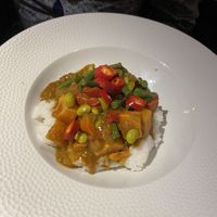 Vegan sweet potato curry. The only heat was from the chillis and it was super tasty. We got a portion of chips to share.  at The Cromwell Cottage in Kislingbury