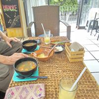 Lentil/veggie soup with fresh onions, cilantro and spicy salsa 😋 at La Garnacheria Vegana in Cuernavaca