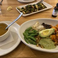 Ancient grain bowl and half order butternut squash soup. Brussel sprouts in the background   at True Food Kitchen in The Woodlands
