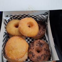 Donut nature, chocolate donuts and filled donut with cream at Radagast Vegan Bakery in Rome