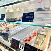 Display of the food. You can also notice some savoury choices: sandwich with vegan chicken salad, vegan cooked ham and mozzarella, vegan tuna and tomato  at Radagast Vegan Bakery in Rome