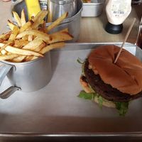 Veggie bean burger with lettuce, tomato and guacamole with a side of home-made fries (all Vegan) at Grains 864 in Faro