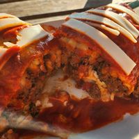 Smothered French fry burrito with vegan cheese and chorizo at La Cabana de Raya in Astoria