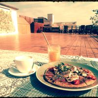 Delicious pancake, oat milk coffee and fresh juice with a surprising passport straw! 😍 at Manipura Ethic Cafe & Bar in Baku