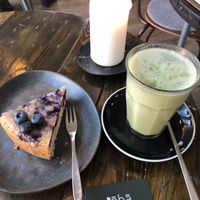 Moringa latte and blueberry vegan cake  at Cafe Oha  in Frederiksberg