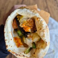 Falafel + veggie wrap $14.00: amazing taste, esp with spicy mango sauce, mixed with potato salad, yumm at Falafel Place in Collingwood
