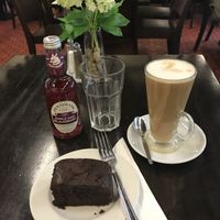 Vegan chocolate brownie and an oat milk latte at Benmore Garden Cafe in Dunoon